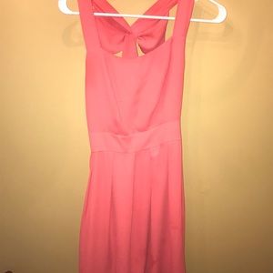 Coral dress with bow detail on the back
